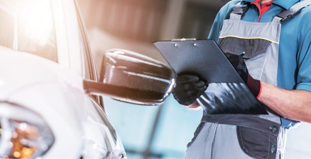 Technician checking on a vehicle, Nissan piece-rate compensation may violate Florida, Georgia and Alabama labor laws governing minimum wage and other employment benefits.