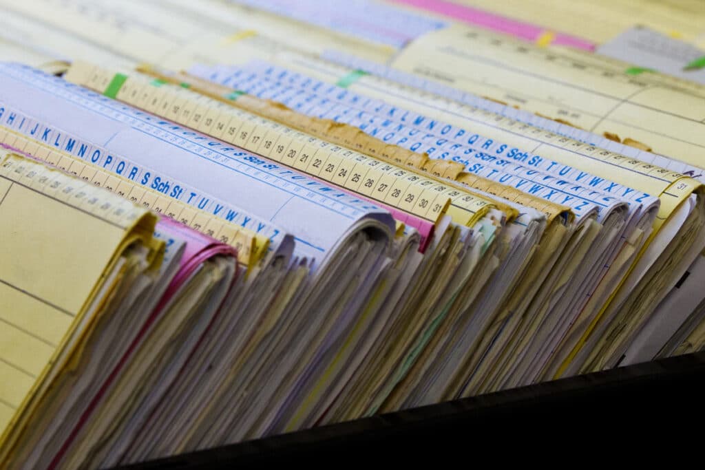 Close up of record keeping books, representing the Federal retirement savings plan lawsuit.