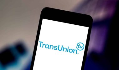 TransUnion logo displayed on a smartphone screen, representing the TransUnion Rental Screening Solutions settlement.