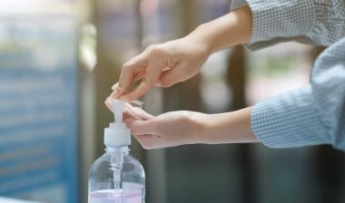 Close up of a girls hands putting hand sanitizer on, representing the Artnaturals hand sanitizer settlement.