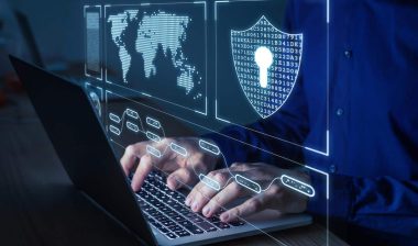 Close up of male hands typing on a keyboard with a data security concept overlay, representing the Comprehensive Health Services data breach settlement.