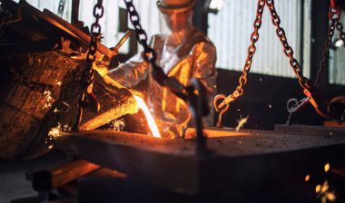 A worker pouring hot molten, representing the USMR settlement.