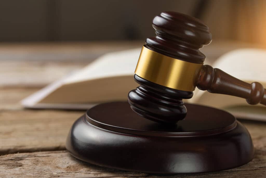 Close up of wooden gavel, representing the ruling on Florida’s ban on Medicaid coverage for gender-affirming care for trans individuals.