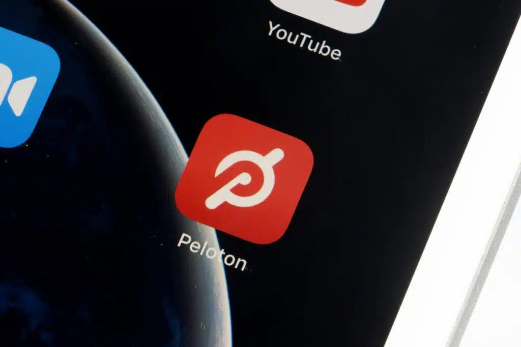 Close up of the Peloton app displayed on a smartphone screen, representing the Peloton class action.