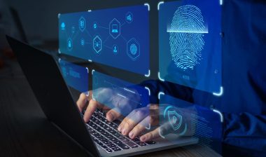 Close up of student using a computer with a biometric data concept overlay, representing the Respondus class action lawsuit settlement.