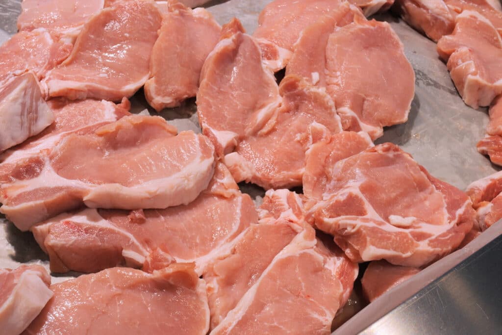 Close up of raw pork, representing the Seaboard settlement.