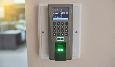 Close up of a biometric time clock, representing the PeopleNet settlement.
