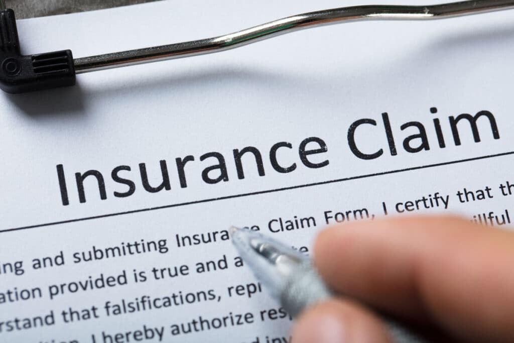 Close up of insurance claim paperwork, representing the Greater New York Mutual Insurance depreciation class action settlement.