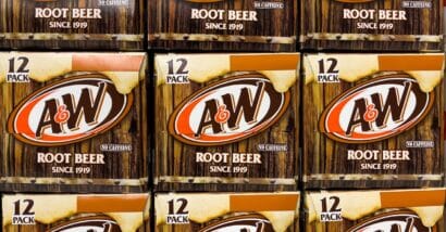 Cases of A&W root beer are seen stacked, representing the A&W settlement.