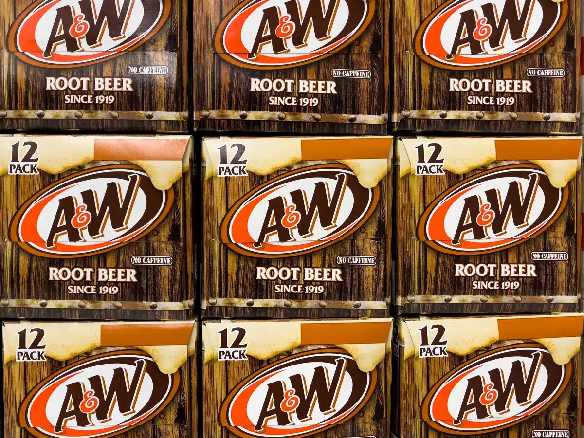 Cases of A&W root beer are seen stacked, representing the A&W settlement.