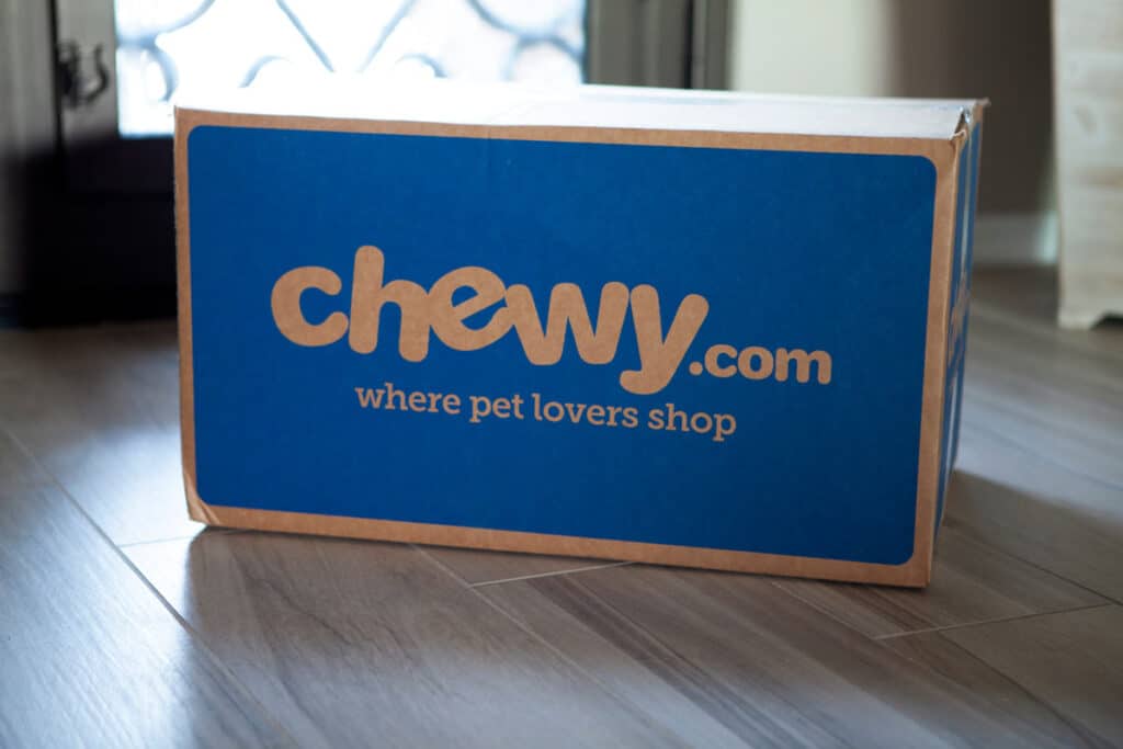 Delivered Chewy.com box at a doorstep, representing the Chewy class action.