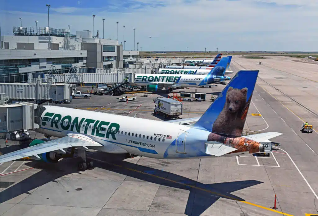 Exterior of a Frontier airplane at an airport, representing the Frontier bag fees and fraudulent charges class action.