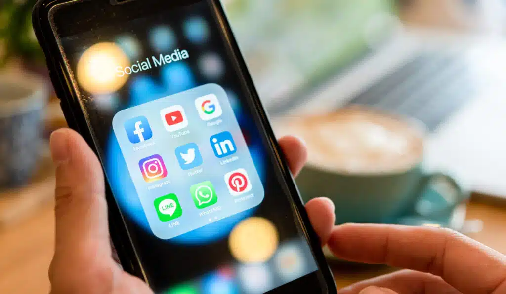 Close up of social media apps displayed on a smart phone screen, representing the Biden administration social media ruling.