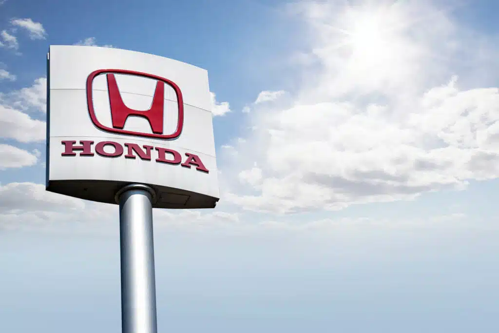Honda sign against a bright blue sky, representing top recalls for the week of July 3.