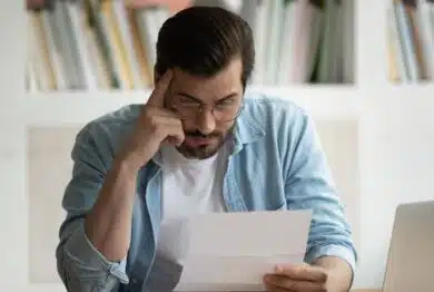 Man reading Data breach notification, Data breach letters inform consumers when and how their information was compromised by data breach incidents.