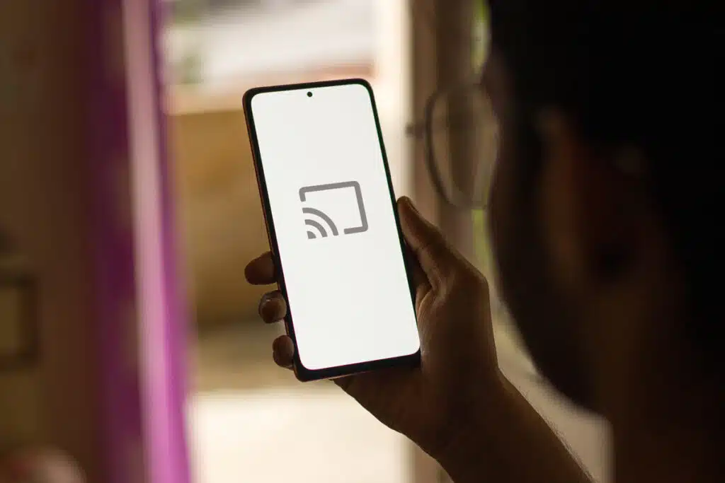 Close up of Chromecast symbol displayed on a smartphone screen, representing the Google Chromecast trial verdict.