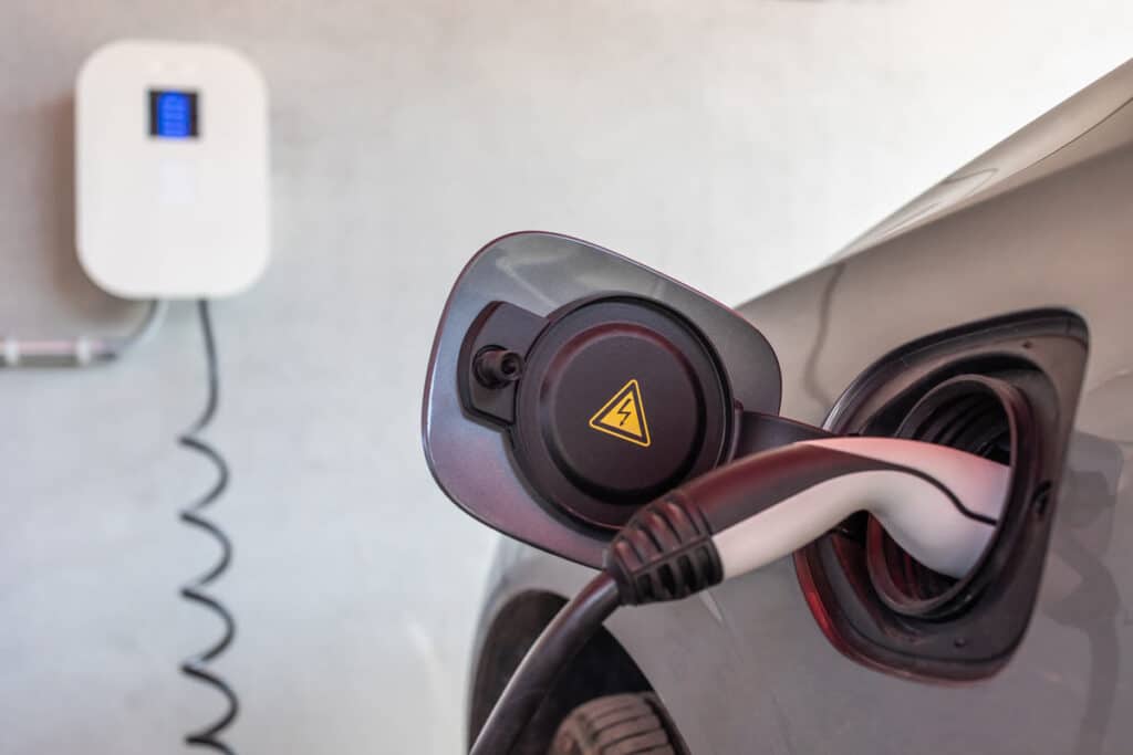 Close up of an electric vehicle being charged, representing the Hyundai/Kia electric vehicle chargers class action.