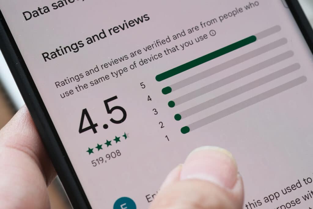 Close up of a product review page displayed on a smartphone screen, representing the FTC’s ban on fake online reviews.