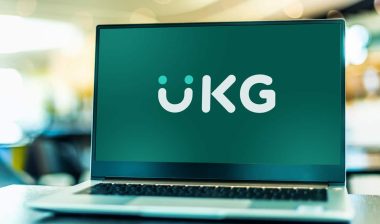UKG logo displayed on a laptop screen.