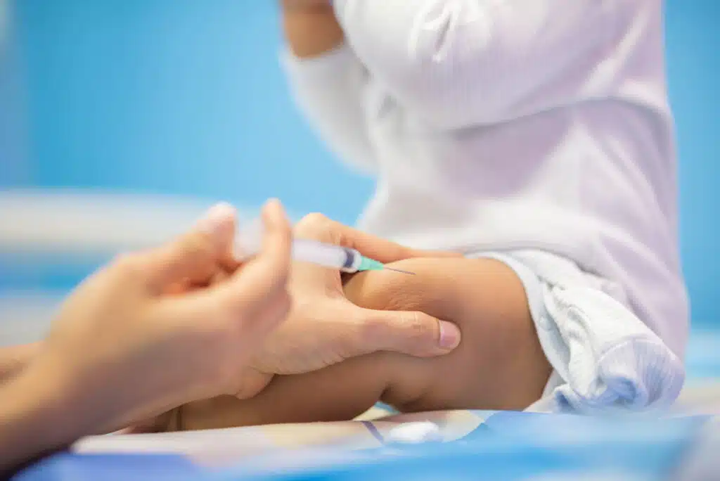 An infant receiving a vaccine, representing the infant RSV vaccine.