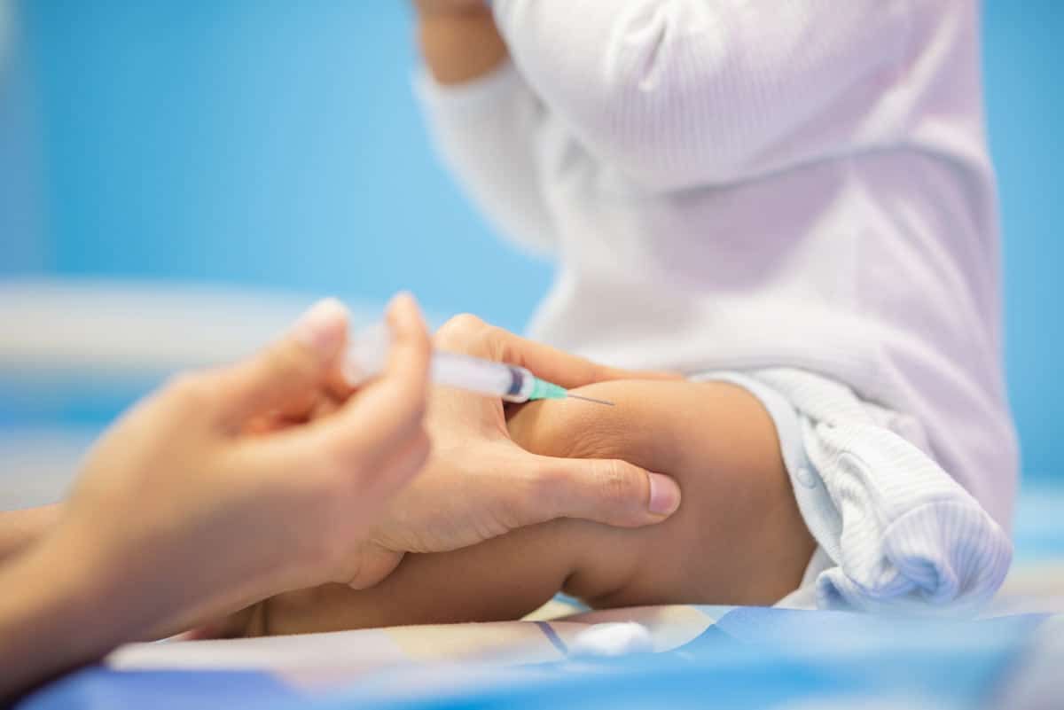 An infant receiving a vaccine, representing the infant RSV vaccine.