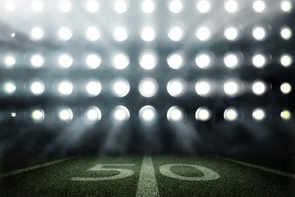 Bright stadium light on a playing field, representing recent sports lawsuits.