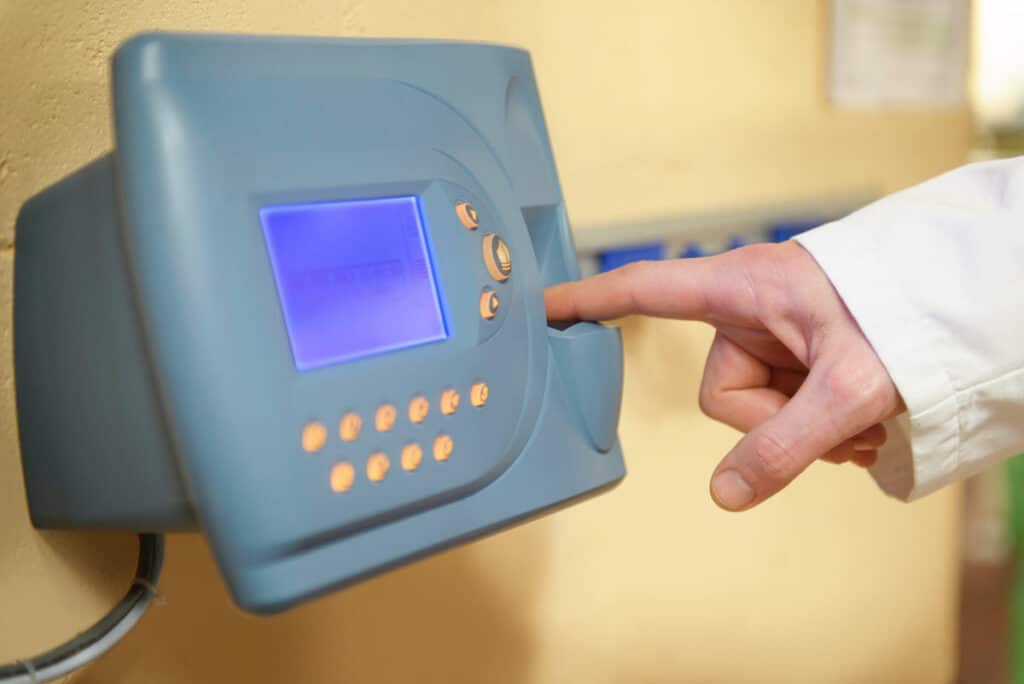 Close up of a fingerprint time clock, representing the Standard Market BIPA class action settlement.