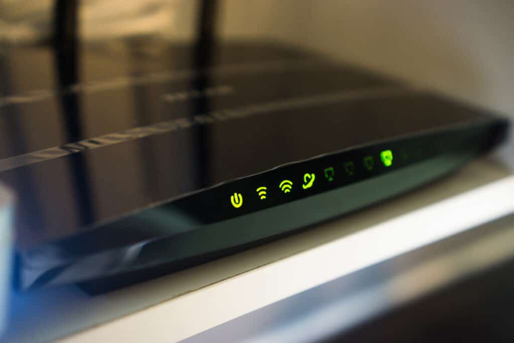 Close up of a WiFi router, representing the Optimum and Suddenlink fees class action lawsuit settlement.