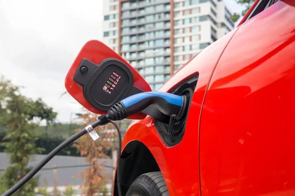 Close up of a Jaguar electric car charging, representing the Jaguar class action.