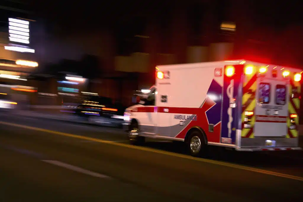 An ambulance driving along the road, representing the Texas abortion ban lawsuit ruling.