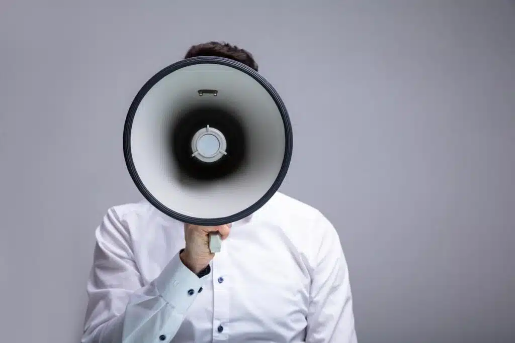 A man using a megaphone, representing top recalls for the week of Aug. 14.