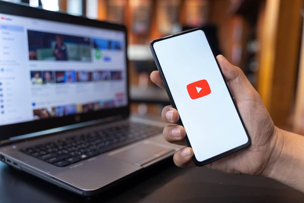 YouTube logo displayed on a smartphone screen, representing the YouTube class action.