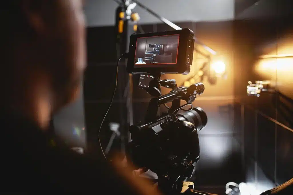 Close up of a film camera on a movie set, The Tetris Effect, representing the Gizmodo editor-in-chief's lawsuit.