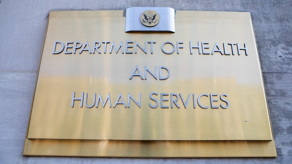 Department of Health and Human Services sign on HHS building, representing the new program for drug price negotiations