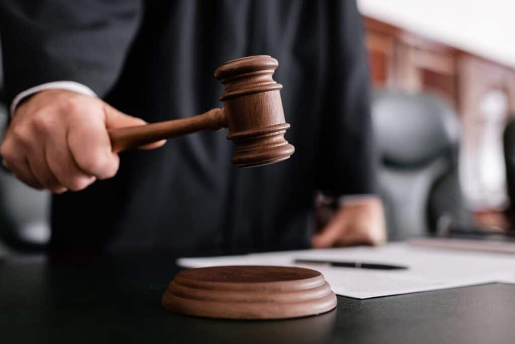 Close up of a judge using a gavel, representing the TCPA text messages ruling.