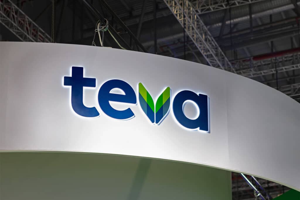 Illuminated Teva signage on a wall, representing the Teva opioid settlement.