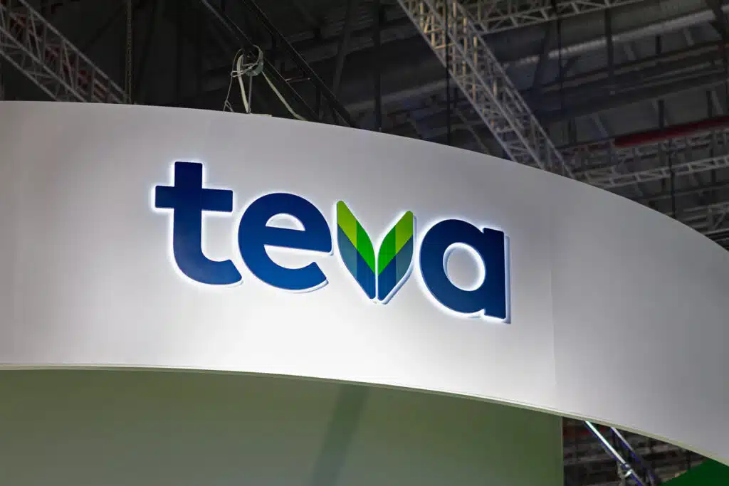 Illuminated Teva signage on a wall, representing the Teva opioid settlement.