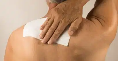 Man wearing a medicated patch for pain