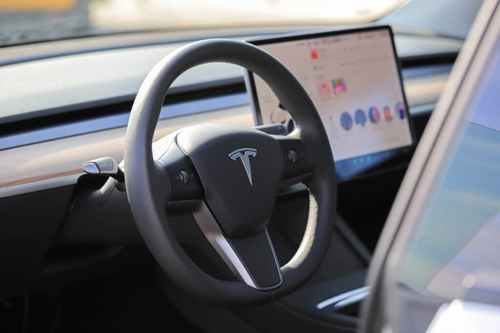 Interior of a Tesla vehicle, representing the Tesla range class action.