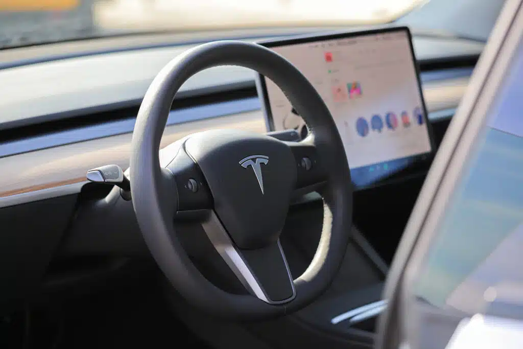 Interior of a Tesla vehicle, representing the Tesla range class action.