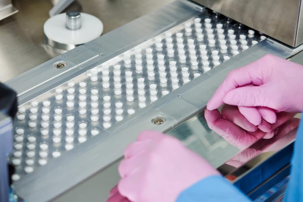 Close up of pills being manufactured, representing the postpartum depression pill.