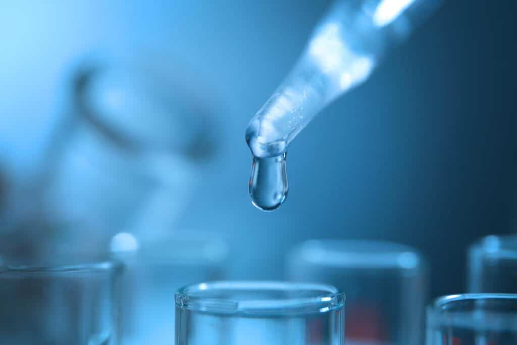 Close up of water being tested in a lab, representing the EPA drinking water testing.