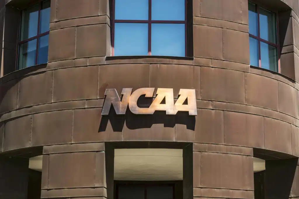 Close-up of NCAA signage, representing the UCLA football player injury decades before his death.