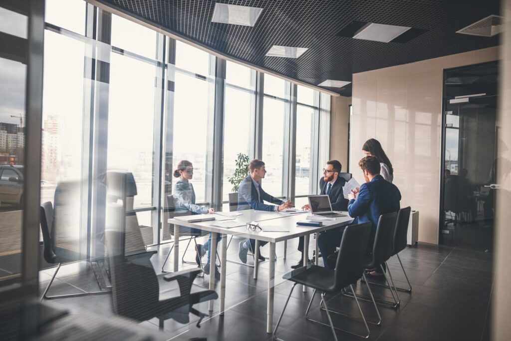 Workers having a meeting in a corporate office, representing the Rocket Mortgage class action.
