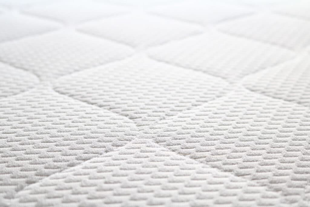 Close up of mattress texture, representing the DreamCloud Mattress Federal Trade Commission  (FTC) settlement.