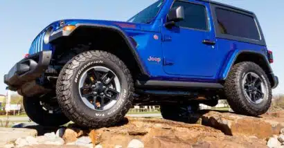 A blue Jeep Wrangler, representing the Jeep settlement.
