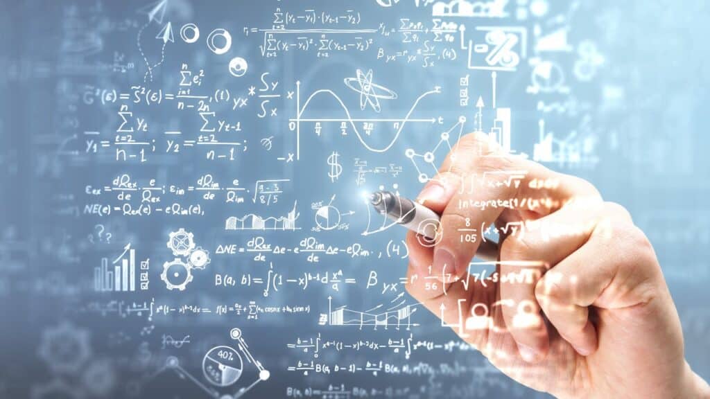 hand writing mathematical formulas on blurry background. Science research concept