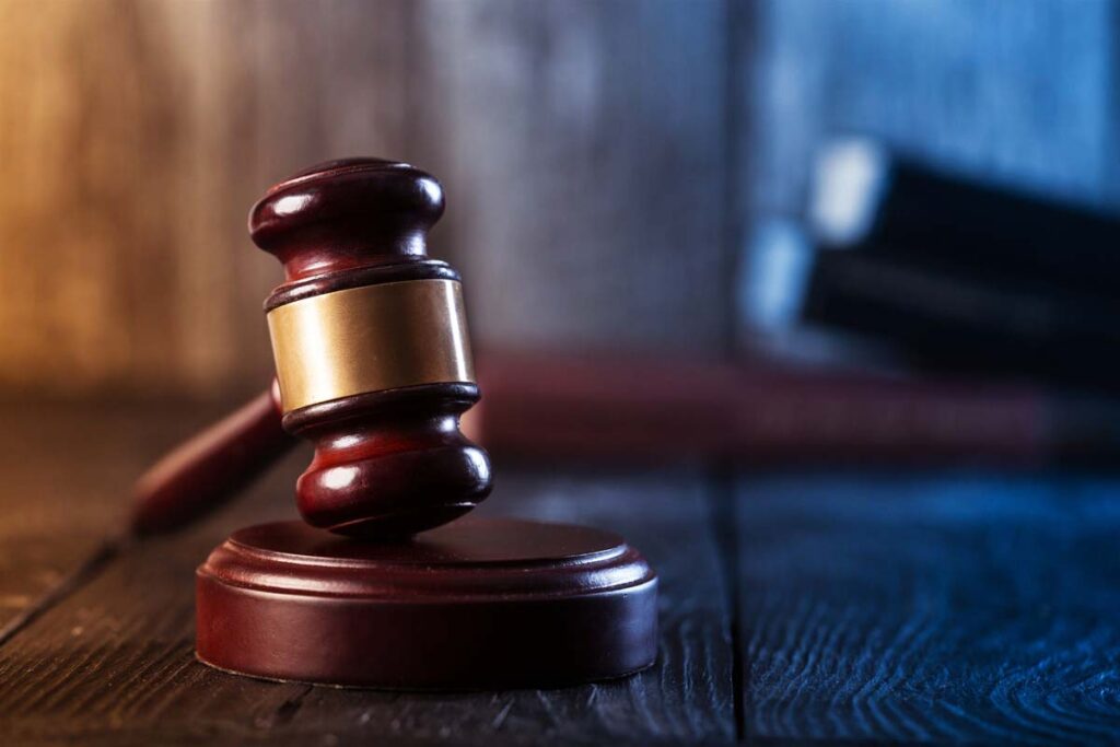 Close up of a wooden judge gavel, representing the Biden DACA plan.