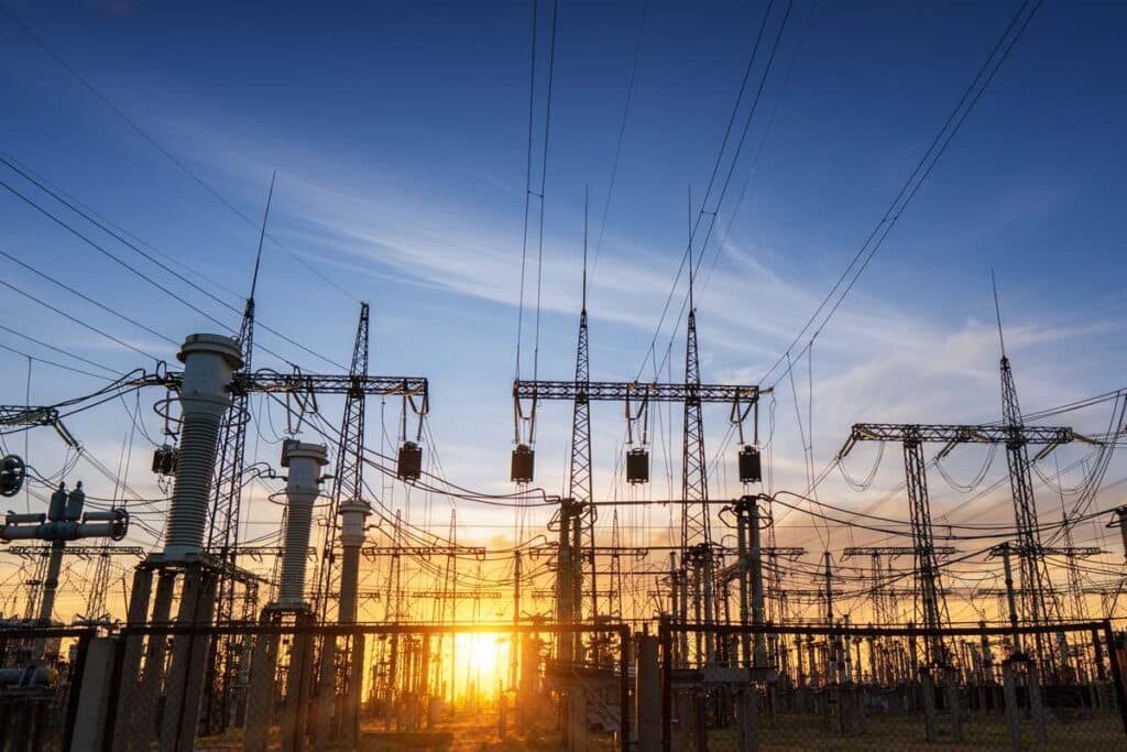 Power line pylons against a sunset, representing the Constellation NewEnergy class action lawsuit.