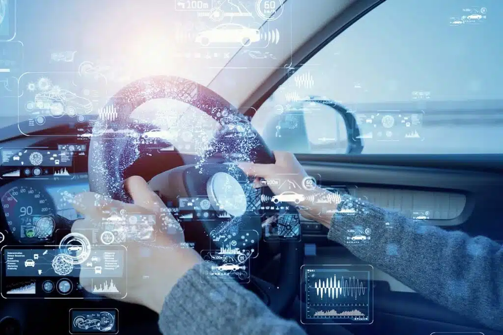 Close up of a persons hands on a steering wheel with a data concept overlay, representing the car data privacy study.